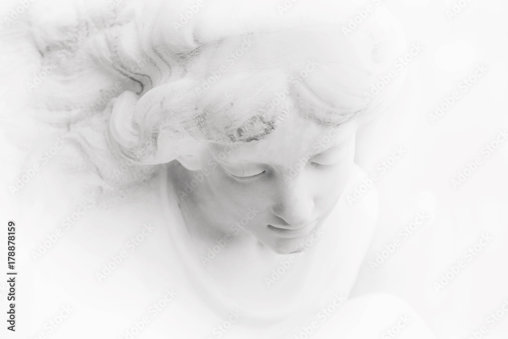 fragment of antique statue of an white angel as a symbol of love, faith and hope (Christianity, religion, goodness,  immortality concept)