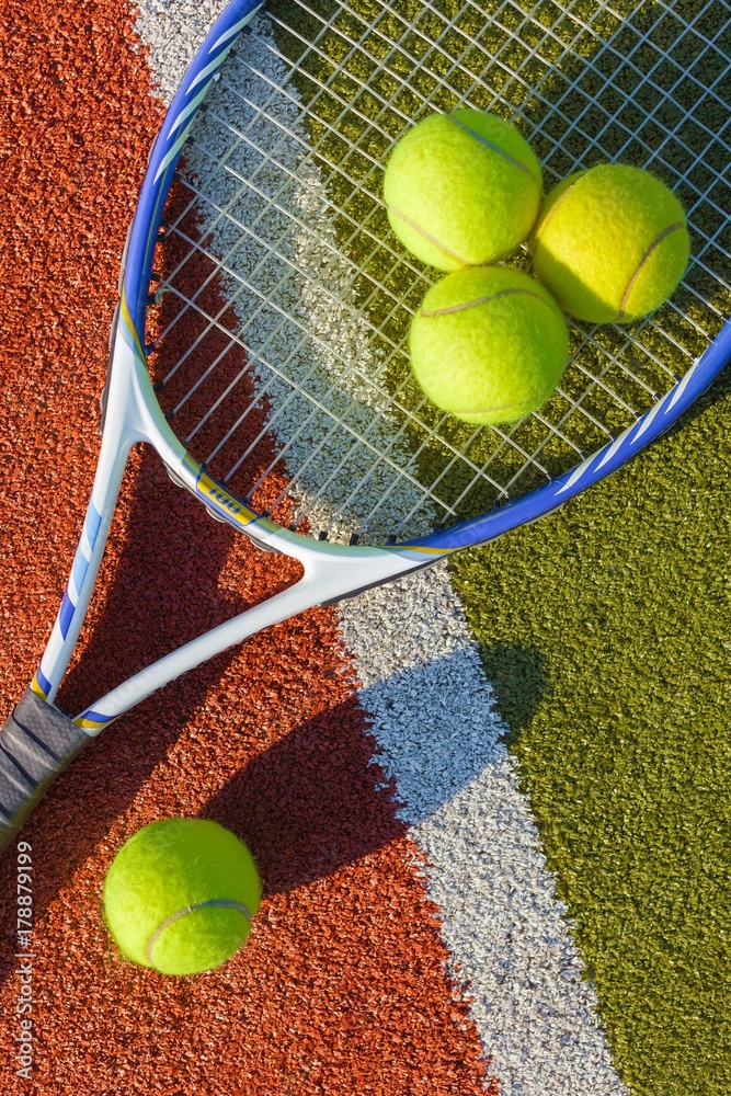 Tennis Racket and Balls on a Tennis Court