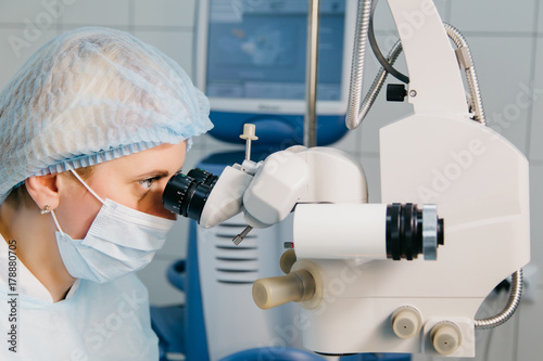 Surgeon with operating system of laser vision correction in the operating room. Ophthalmology. Medicine photo