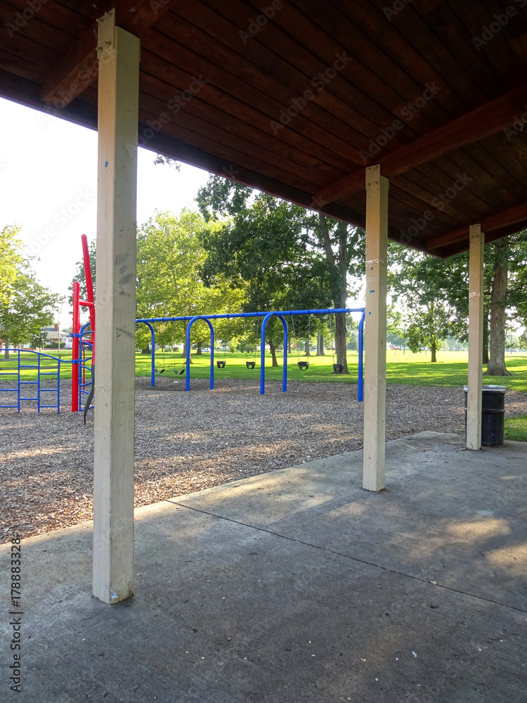 An open shelter house in a tiny kids play area. An open shelter house in a tiny kids play area.