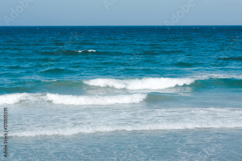 Waves in the blue ocean on a clear day