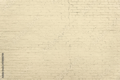 Old beige brick wall background texture