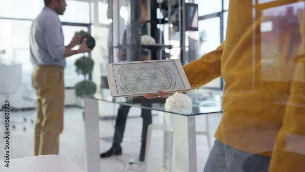  Creative team creating 3D printed objects & working on tablet computers