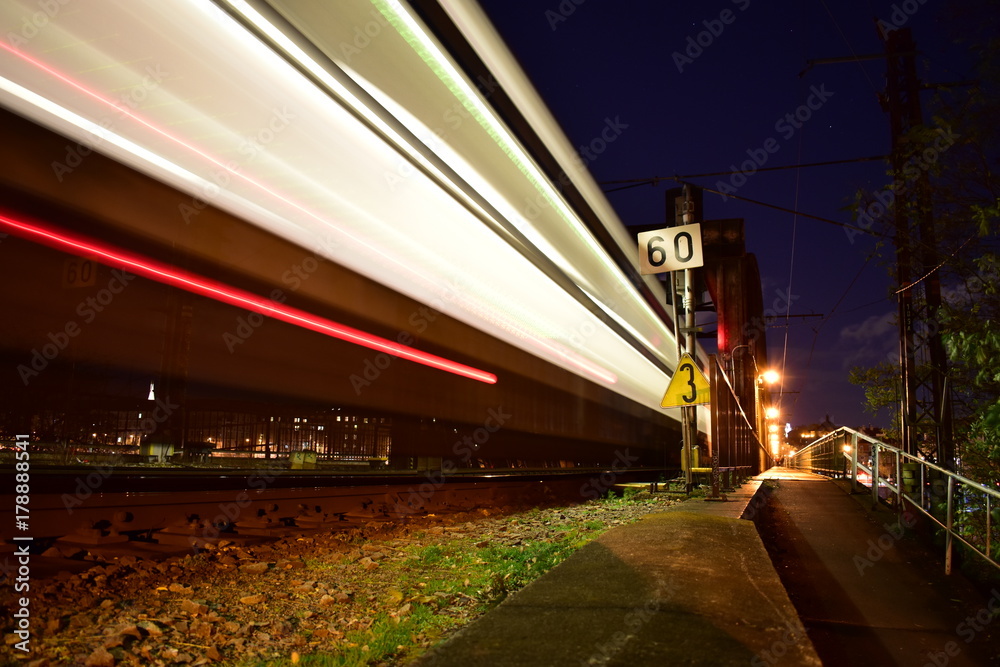 Fototapeta premium Train in night on bridge.