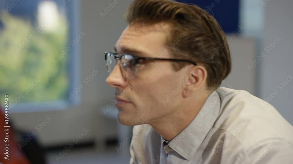  Cheerful casual businessmen playing counter connecting game in the office