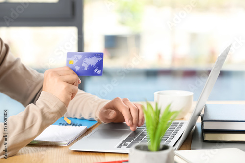 Man using credit card and l...