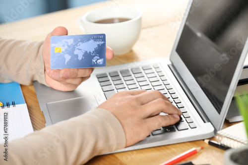 Man using credit card and l...