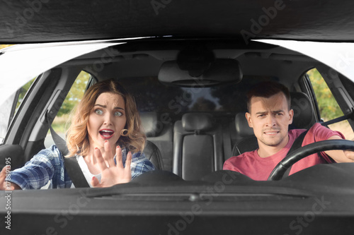 Emotional young couple in c...