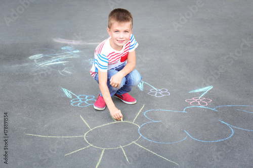 Cute little boy drawing wit...