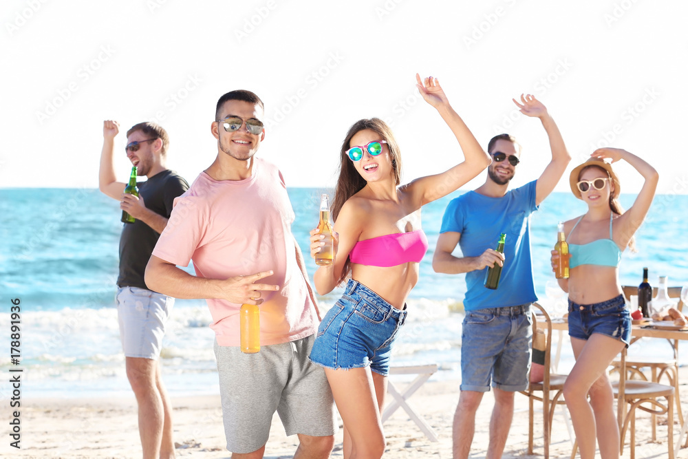 Fototapeta premium Young people having party on beach