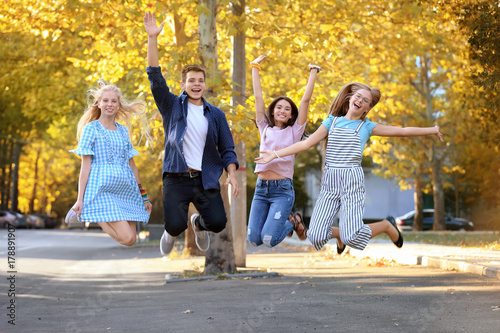 Happy teenagers on city street