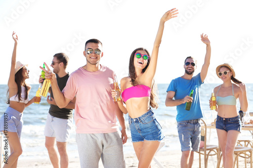 Young people having party on beach