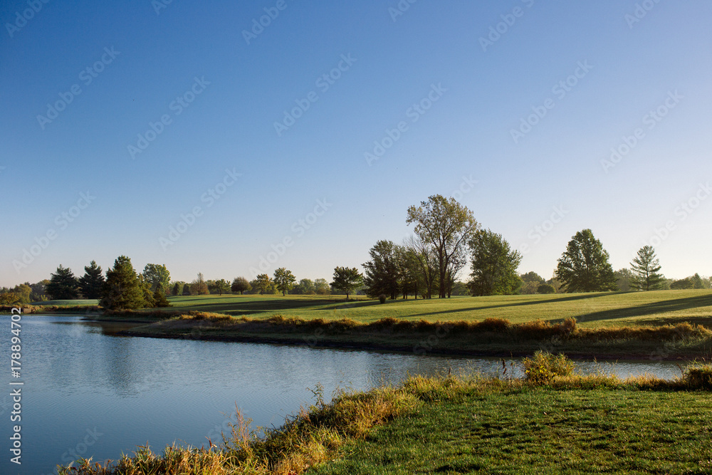 Fototapeta premium Fall landscape with lake. Morning on the lake