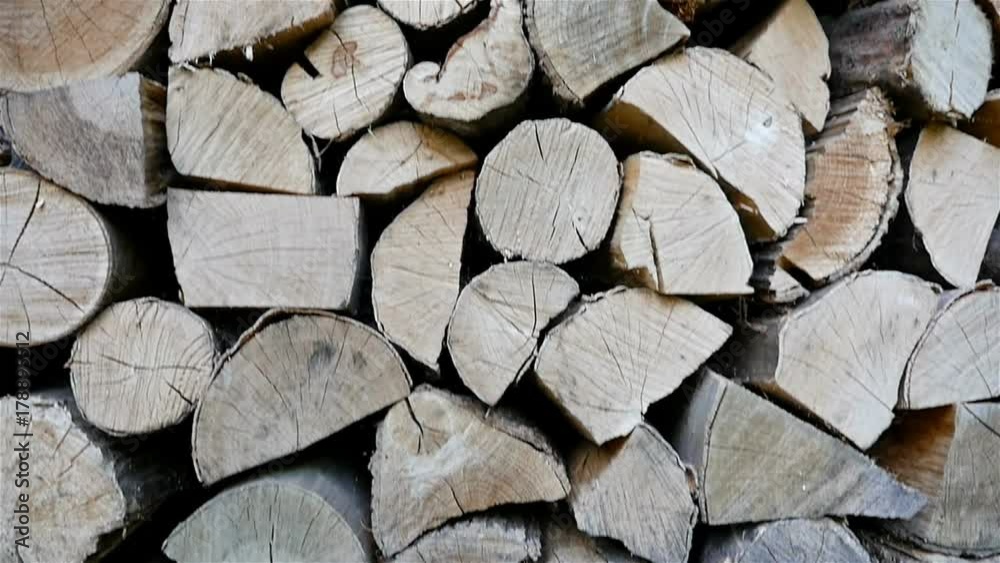 A pile of chopped wood prepared for winter, dolly A pile of chopped wood prepared for winter, dolly
