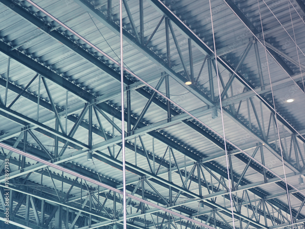 Big warehouse steel plate roof ceiling structure, with iron beams, perspective background, as shadow reflection from glass tile wall