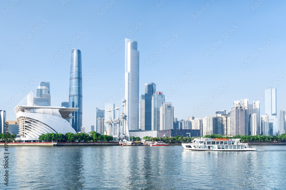 White tourist boat sailing along the Pearl River in Guangzhou