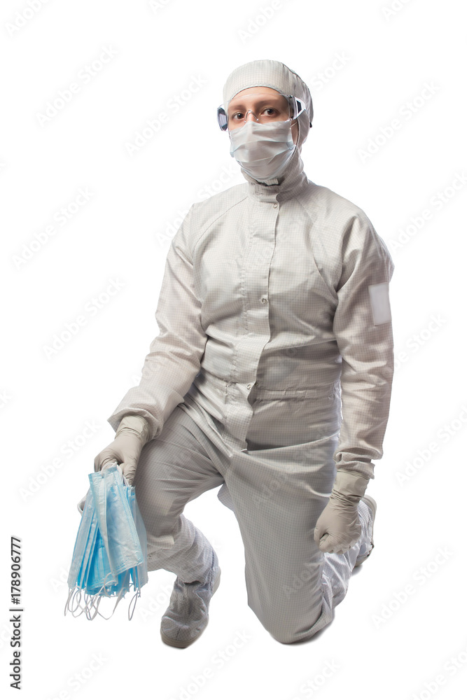 girl in protective suit sitting holding medical mask girl in protective suit sitting holding medical mask