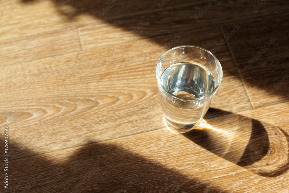 Fototapeta premium Glass of water on table