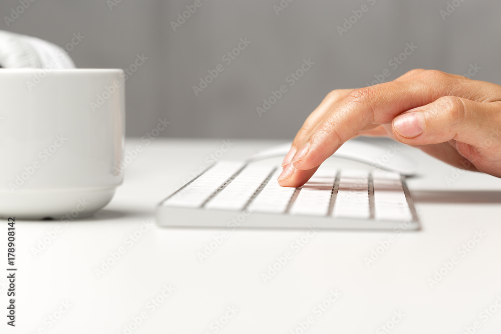 Woman's hands on a keyboard