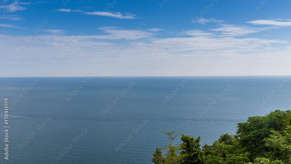 Blue sky over the prefect Ocean for background.
