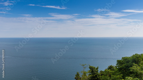 Blue sky over the prefect Ocean for background.