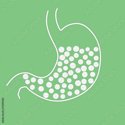 Φωτογραφία Stomach with pills on green