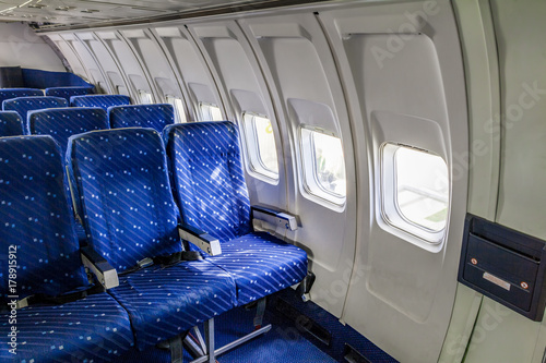 Empty seat rows in commercial aircraft cabin.