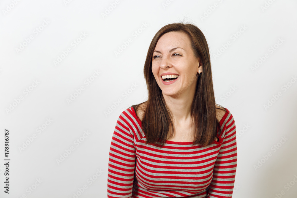 Gorgeous European young happy brown-haired woman with healthy clean skin and charming smile, dressed in casual red and grey clothes, laughing and enjoying on a white background. Emotions concept. Gorgeous European young happy brown-haired woman with healthy clean skin and charming smile, dressed in casual red and grey clothes, laughing and enjoying on a white background. Emotions concept.