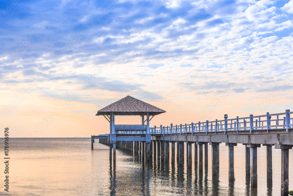 Old wood bridge pier against beautiful sunset sky use for natural background ,backdrop and multipurpose sea scene Old wood bridge pier against beautiful sunset sky use for natural background ,backdrop and multipurpose sea scene