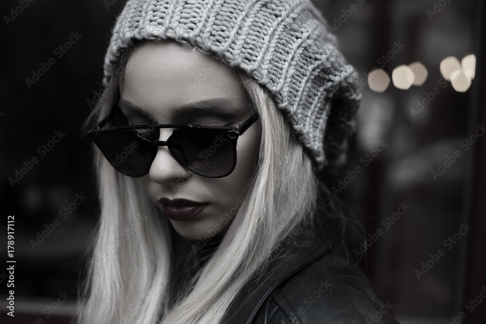 Amazing girl Autumn,spring fashion Outfit. Style hipster trend Girl Swag  beanie hat. Stylish vintage glasses.Monochrome outdoor portrait of young  fashionable woman with long hair posing in street. Photos | Adobe Stock