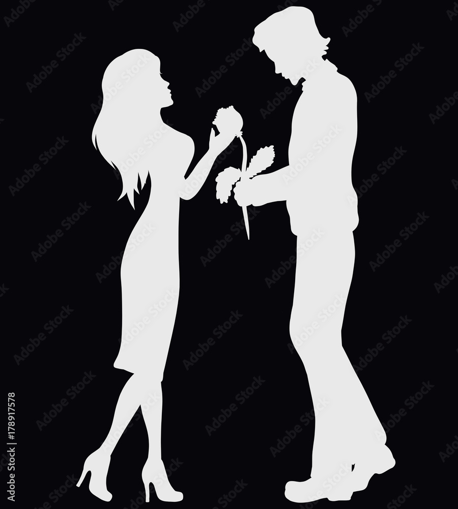 Man giving woman a flower, silhouette of lovers