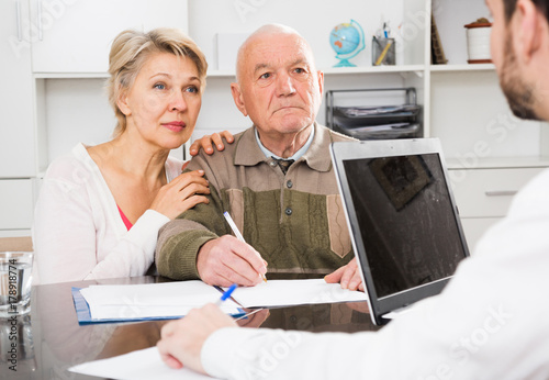 Old man and woman in social department photo