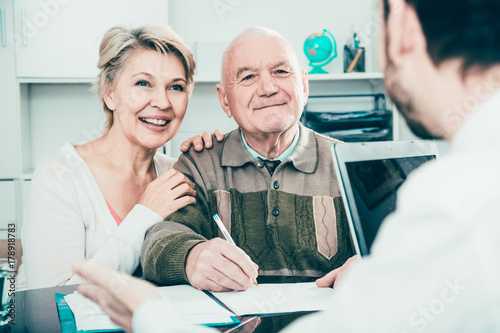 Old man and woman in social department photo