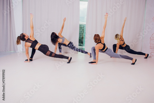 girl teaches Yoga young in the Studio photo