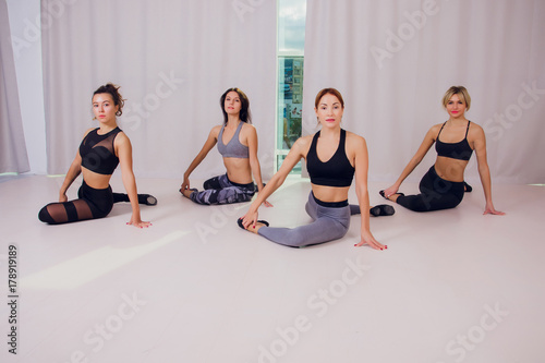 girl teaches Yoga young in the Studio photo