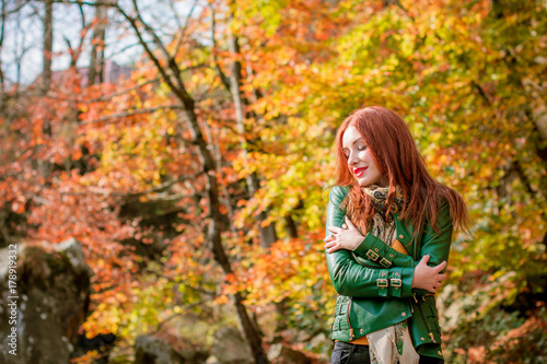 Woman in wild nature for blessing and enjoying nature greatness. Relaxation  meditation  harmony of inner life and mind. Unity of human and world. Exaltation of heart and consciousness.