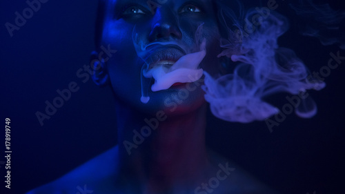 Vape Party, Nightlife. Beautiful Sexy Woman smoking photo