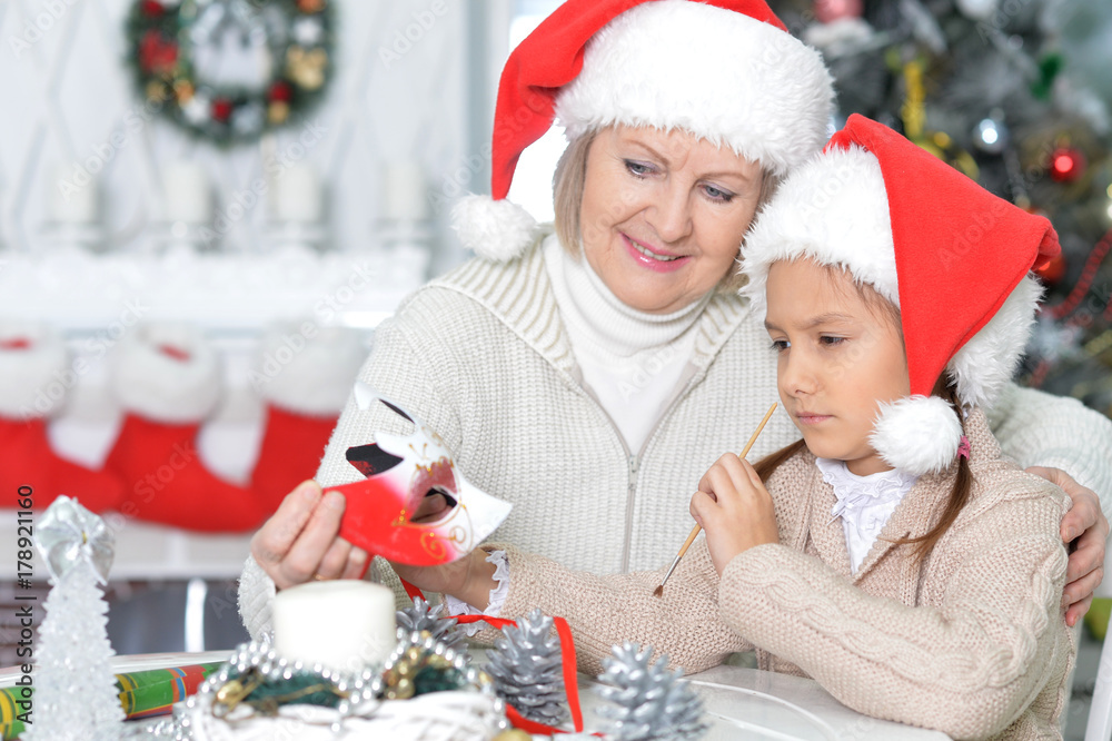 woman and child girl celebrating Christmas woman and child girl celebrating Christmas