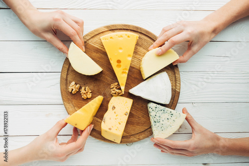 hands holding cheese photo