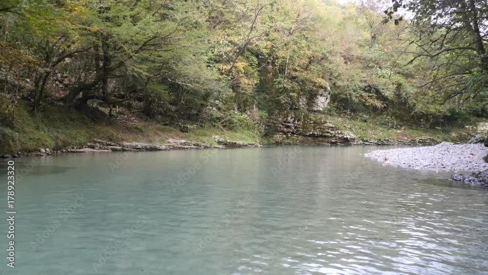 Crystal water with white stones in martvili canyon Crystal water with white stones in martvili canyon