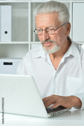 mature man using laptop