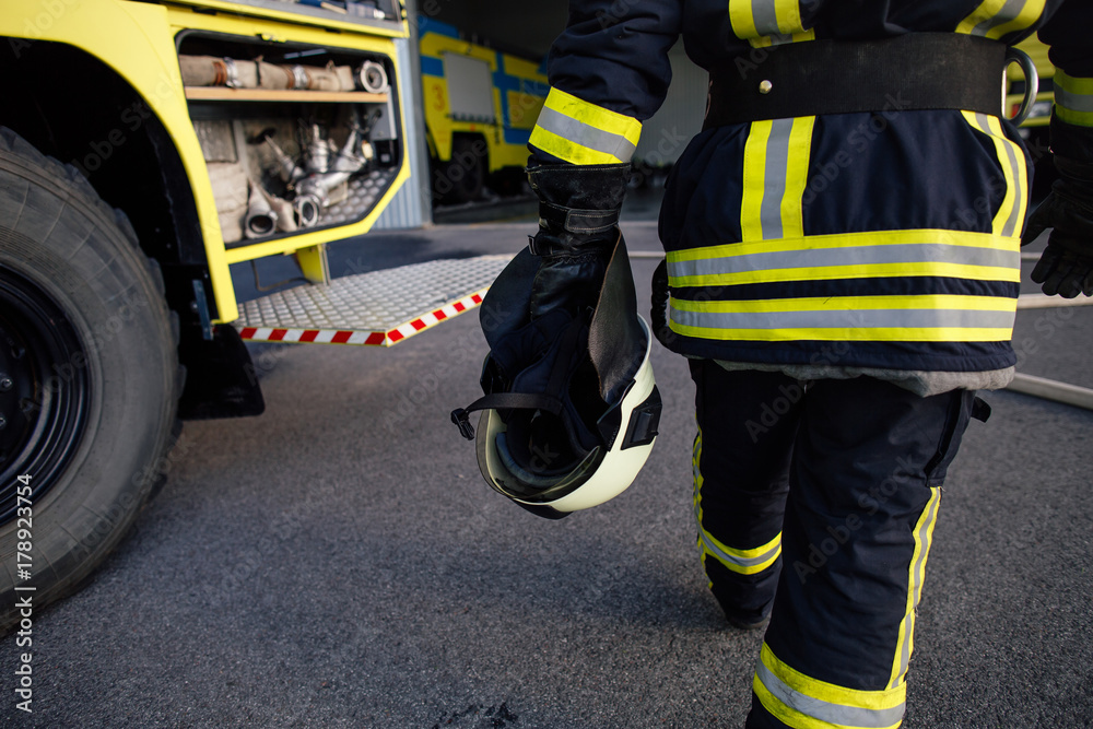 Rescue firefighter in safe helmet and uniform Rescue firefighter in safe helmet and uniform