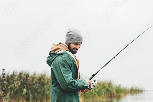 man fishing on cloudy day