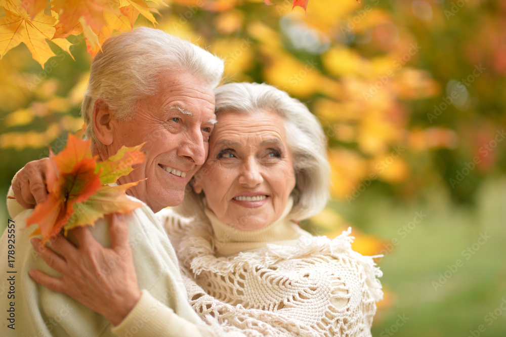 caucasian senior couple with leaves caucasian senior couple with leaves