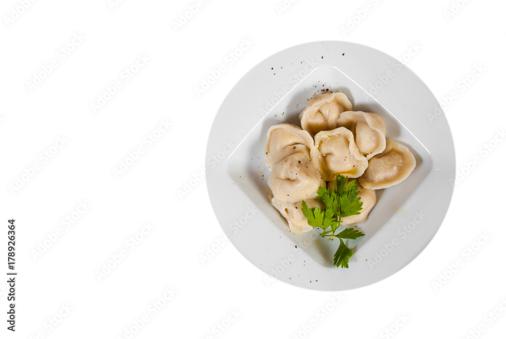 Meat dumplings - russian pelmeni, ravioli with meat. with copy space. top view. isolated on white