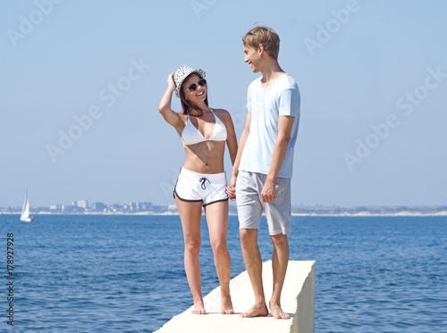 Summer, sea. Cute, lovely couple on the beach © kravik93