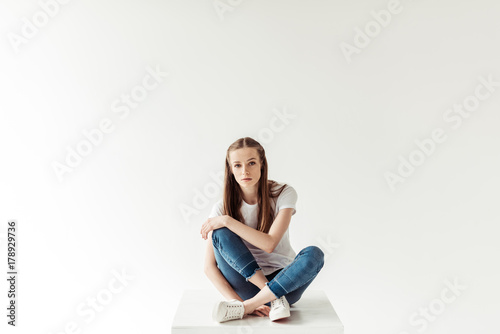 woman in blue jeans and white shirt