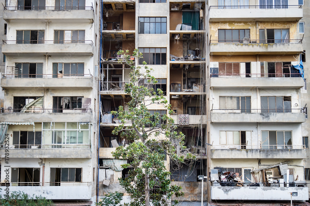 Abandoned appartement flat with trash on the broken balconies, Beirut Lebanon