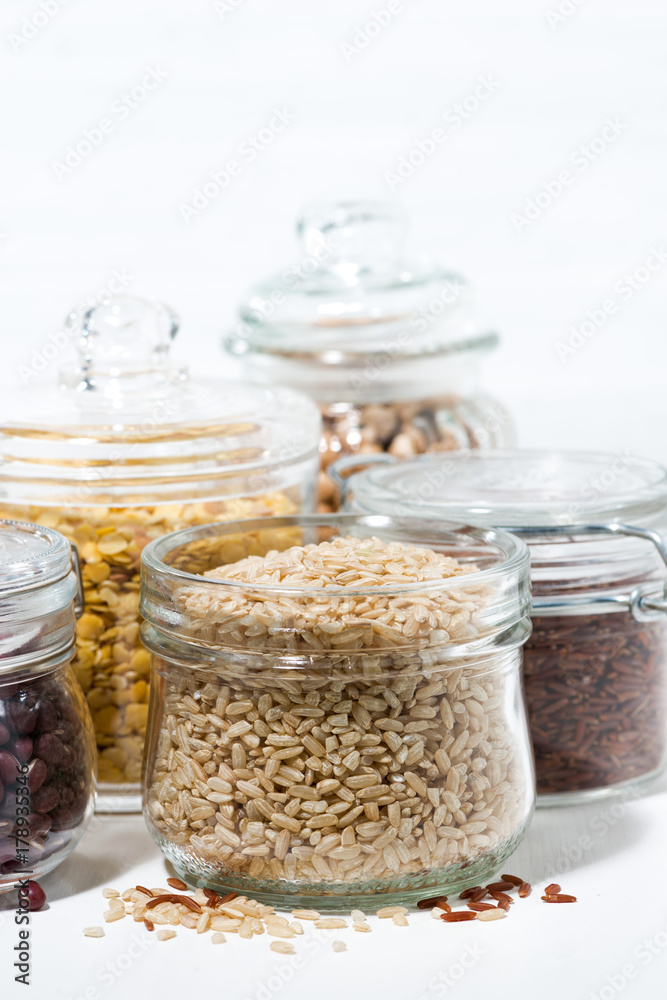 assortment of various cereals and legumes on white background, vertical closeup assortment of various cereals and legumes on white background, vertical closeup