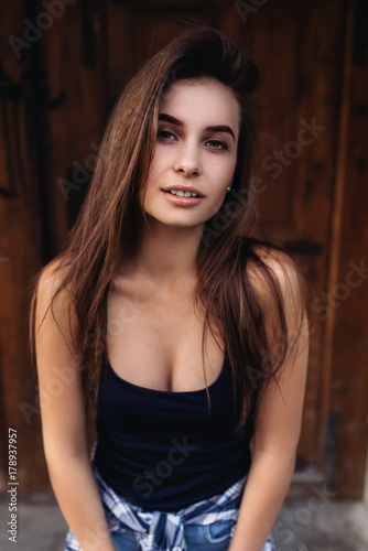 Portrait of a young attractive girl in sunny summer day in the park © Ivan